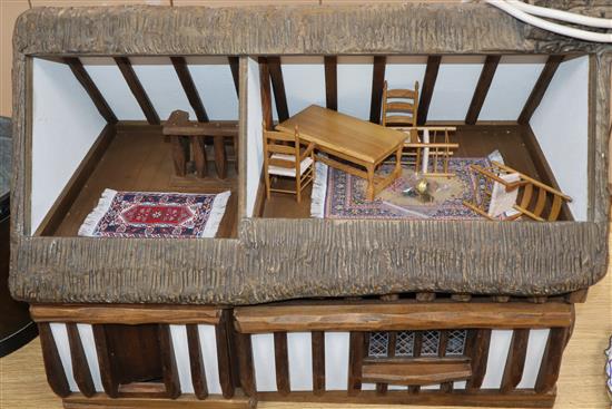 Robert Stubbs cottage style dolls house, dated 1990 - containing some furniture by Jane Norman